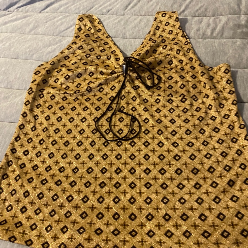 Gold tank top with string shoulder straps